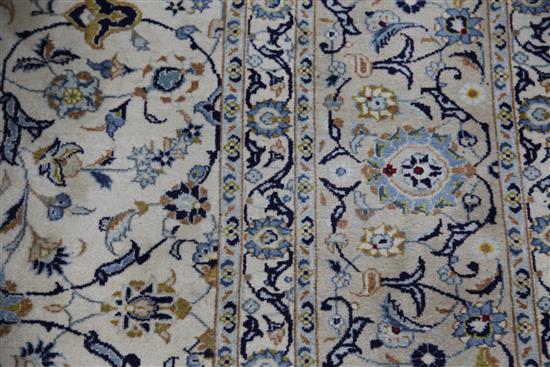 A Tabriz cream ground carpet, 12ft 6in. by 9ft 9in.